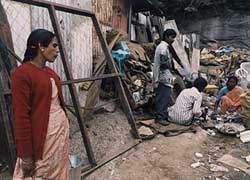 \Unilever's mercury tainted glass was found at this crowded scrap yard in Kodaikanal, India. Photo: Shailendra Yashwant/Greenpeace, 2001